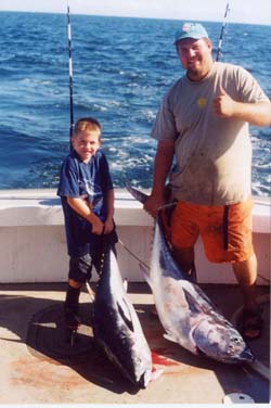 child holding too big fish