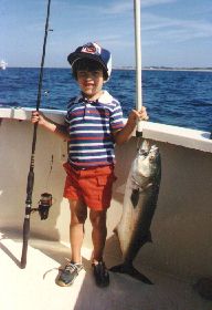 kid and his cod fish