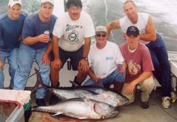 group poses with fish they caught