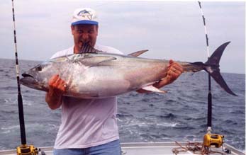 man holding tuna