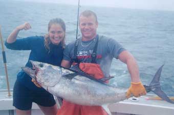 couple holding tuna