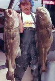 man with 2 cod fish