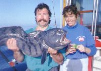 couple with fish caught off Cape Cod